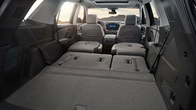 Chevrolet Traverse with folded seats, providing extra cargo space in the interior.