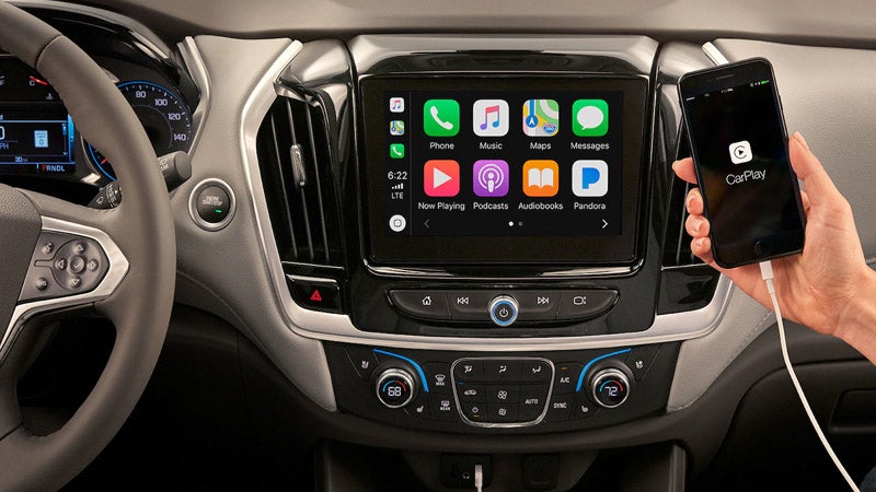 Chevrolet Traverse infotainment system with a phone charging