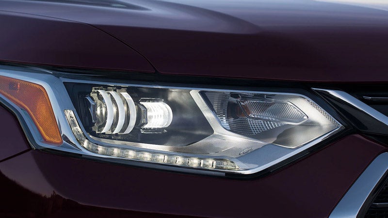 Close-up of the headlamp of a Chevrolet Traverse, highlighting its sleek and modern design.
