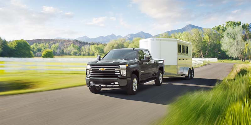 Chevrolet Silverado 2500HD towing a container, demonstrating its powerful towing capability
